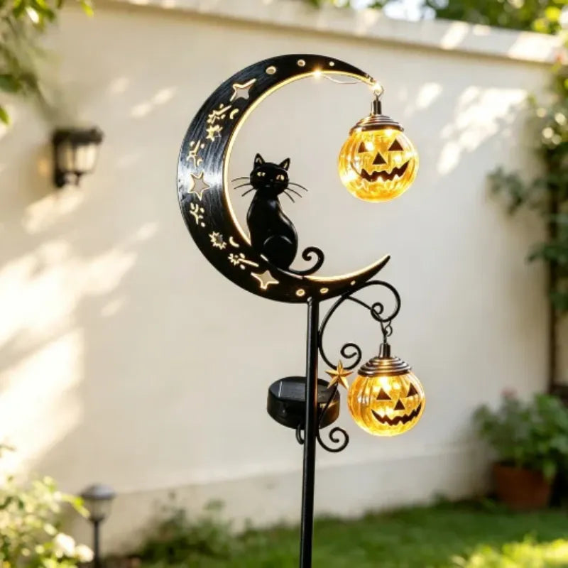 Black cat and pumpkin moon solar garden stake, spooky Halloween outdoor decor by My Store with illuminated design.