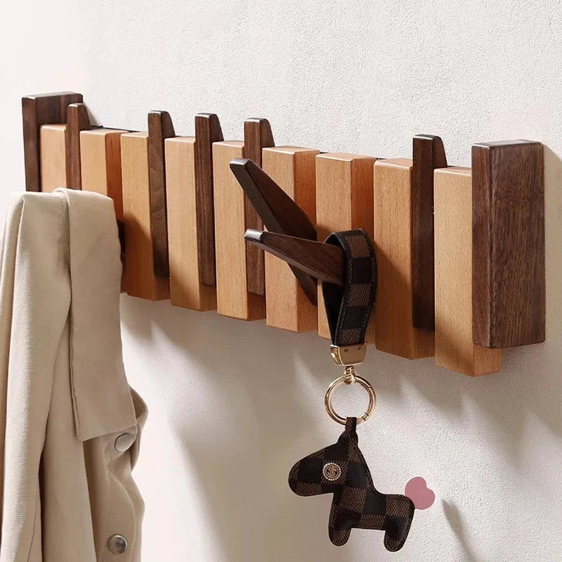 Wooden wall hook from HarmonyCoat by My Store, designed for foyer or hallway organization, featuring a creative piano-inspired design.
